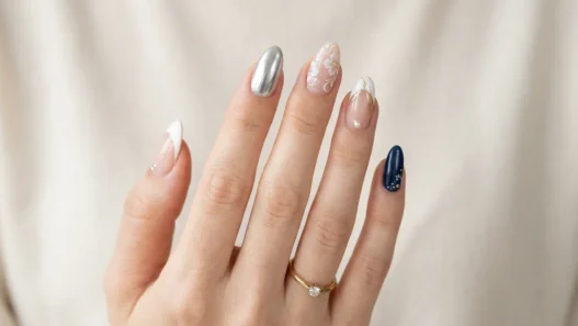 Collection of trending nail designs including French tips chrome accents and various nail art styles