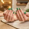 Woman's hands displaying completed vacation wedding manicure with glossy finish on salon table