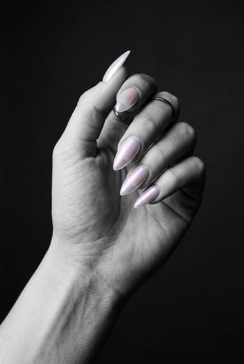 Medium length stiletto nails with milky pearlescent glazed donut sheen and iridescent reflection at the tip